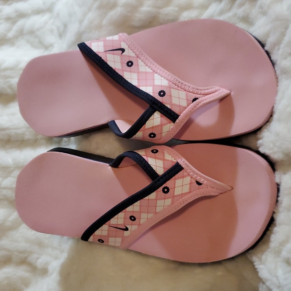 Never worn Nike flip-flops pink and blue size 5